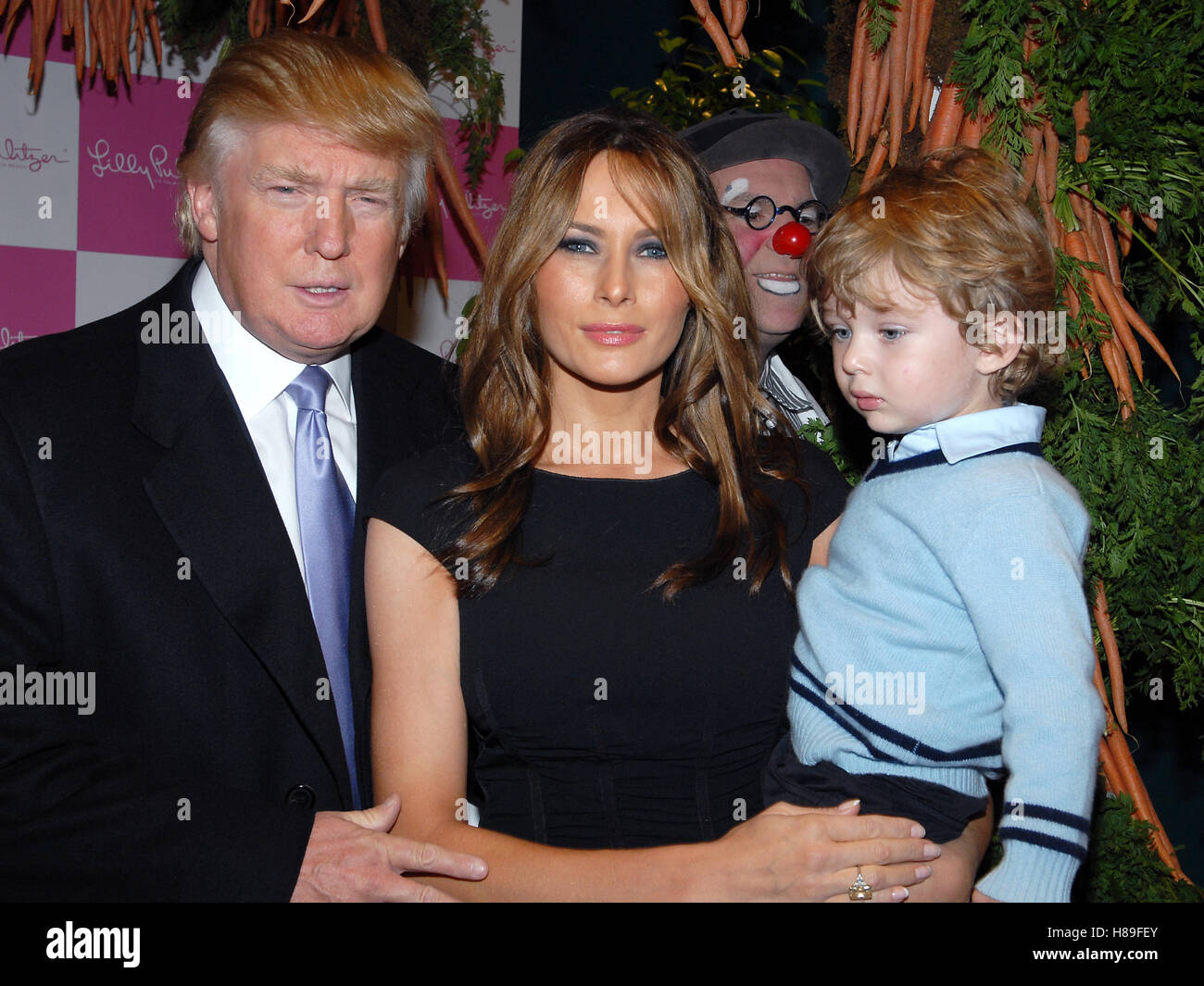 Donald Trump, Melania Trump & Barron Trump attend the 17th Annual Bunny Hop  at FAO Schwartz in New York City on March 11, 2008. © RD / MediaPunch Stock  Photo - Alamy