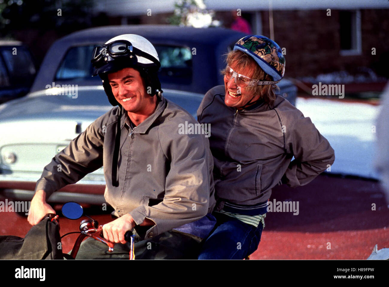 Dumm und Dümmer, (DUMB AND DUMBER), USA 1994, Regie: Peter Farrelly, JIM CARREY, JEFF DANIELS, Stichwort: Motorrad, Helm, Brille Stock Photo