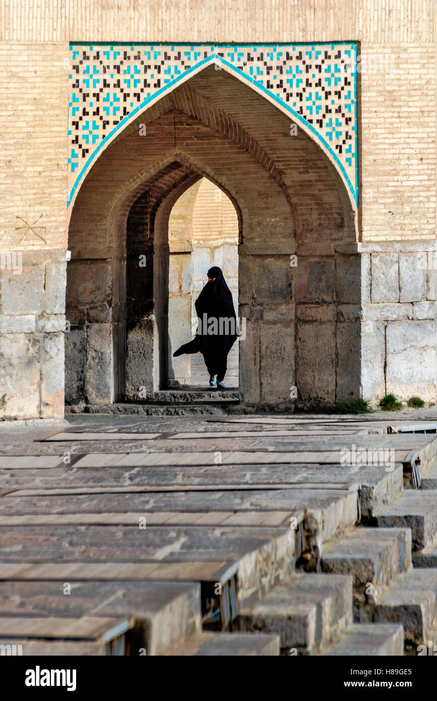 People under the lower arches of Si-o Seh bridge Isfahan Iran Stock Photo