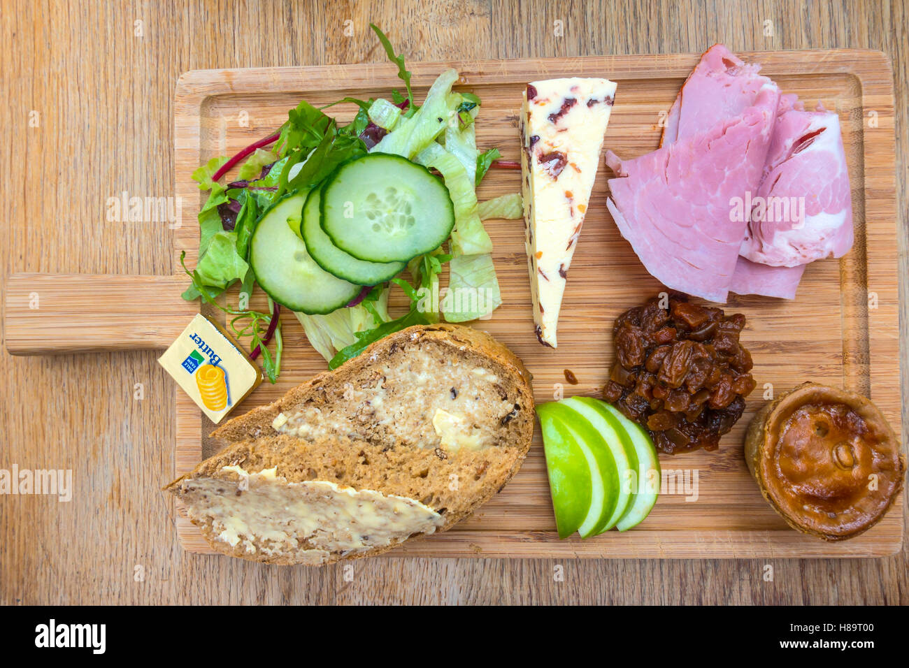 A traditional Ploughman's Lunch of Ham Cheese Pork Pie Salad Pickle and
