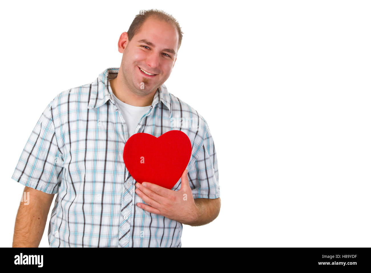 Young man holding red heart - isolated on white background Stock Photo ...
