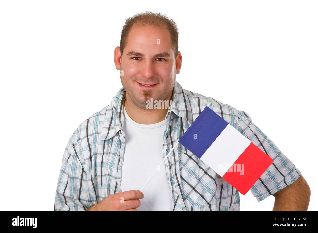 Young man holding french flag isolated on white background Stock Photo