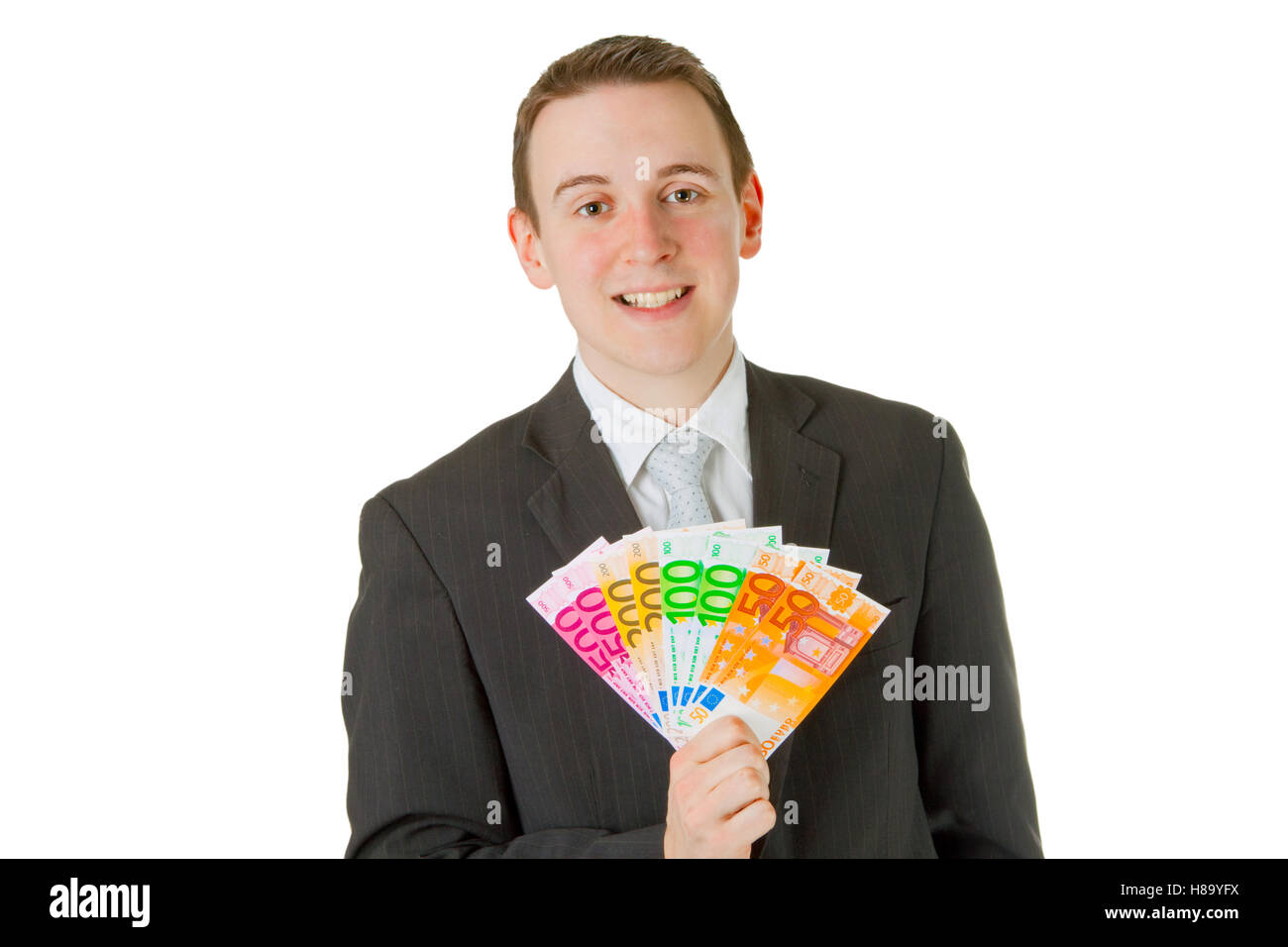 Businessman holding euro banknotes isolated on white background Stock ...