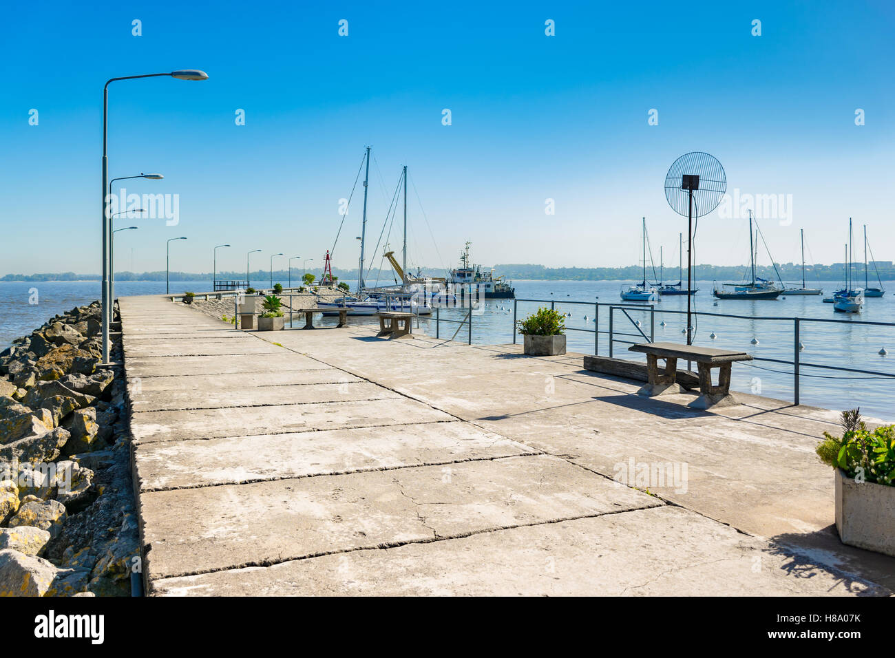 A view over boats moored at the secondary harbor of Colonia del Sacramento, Uruguay Stock Photo