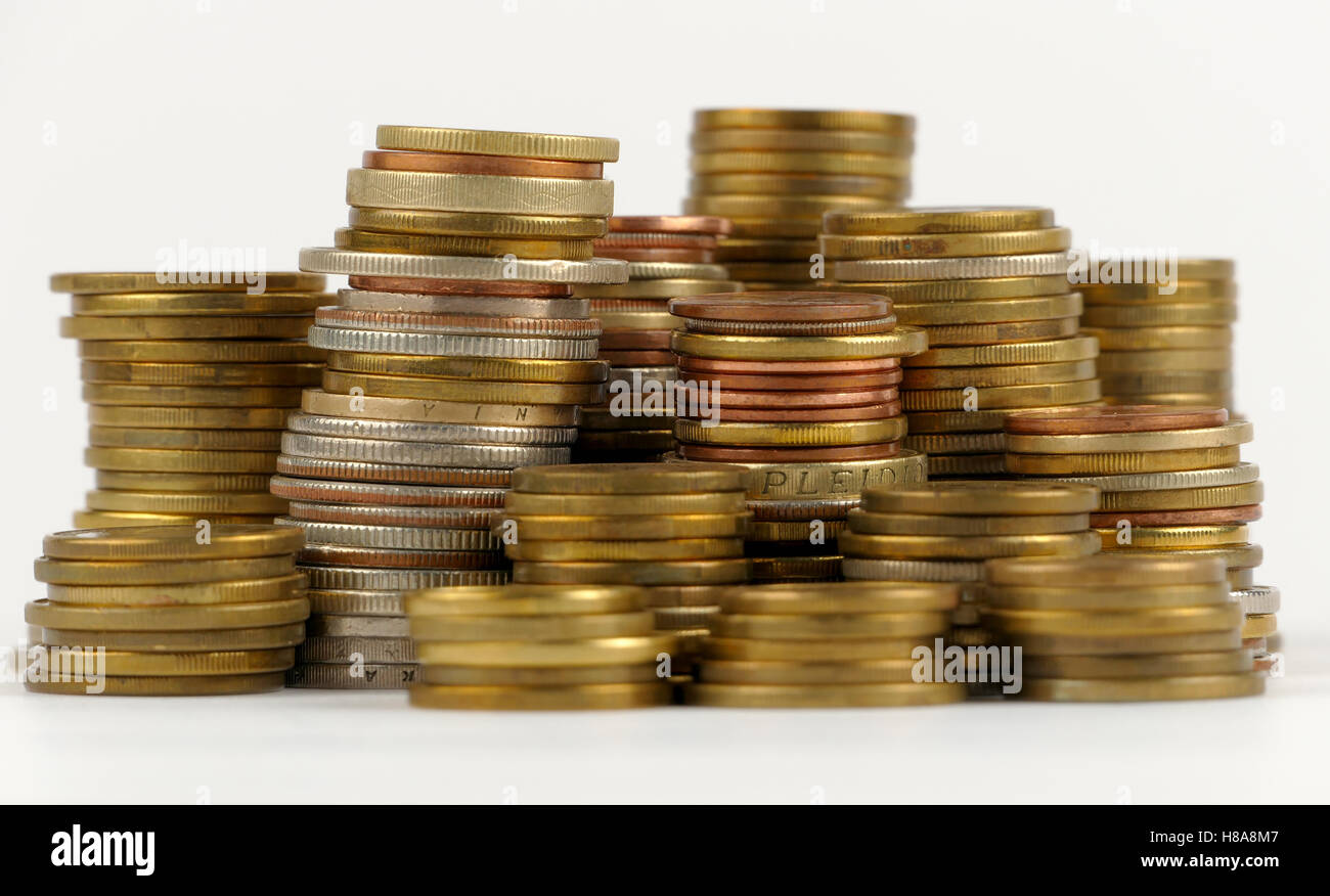 Pile of coins isolated on white background Stock Photo - Alamy
