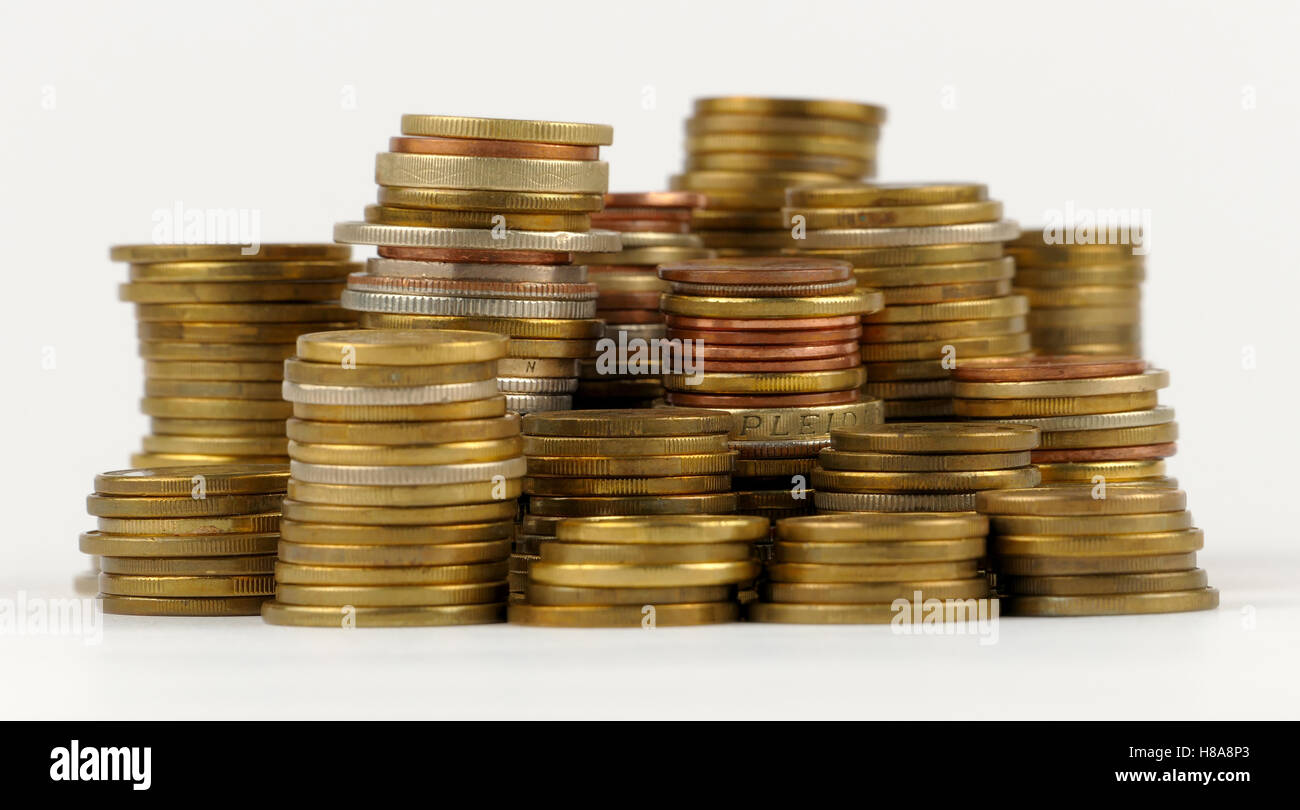 Pile of coins isolated on white background Stock Photo - Alamy