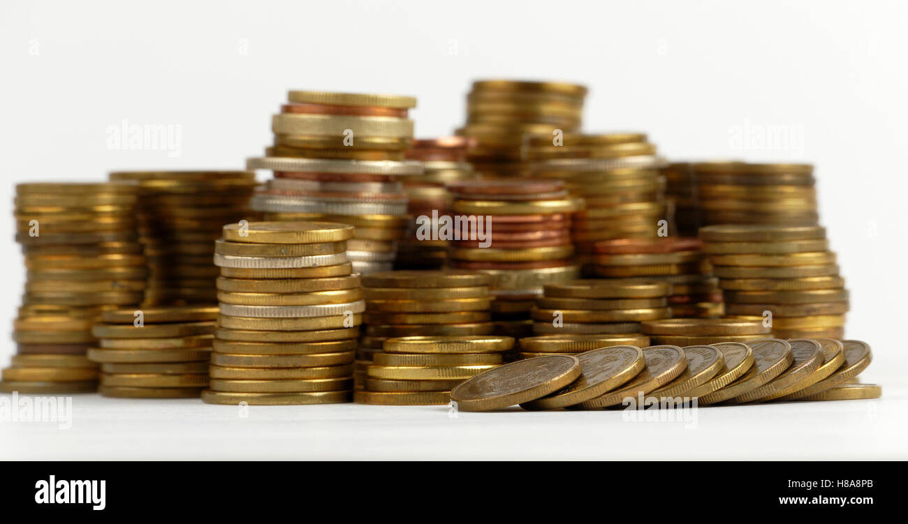 Pile of coins isolated on white background Stock Photo - Alamy