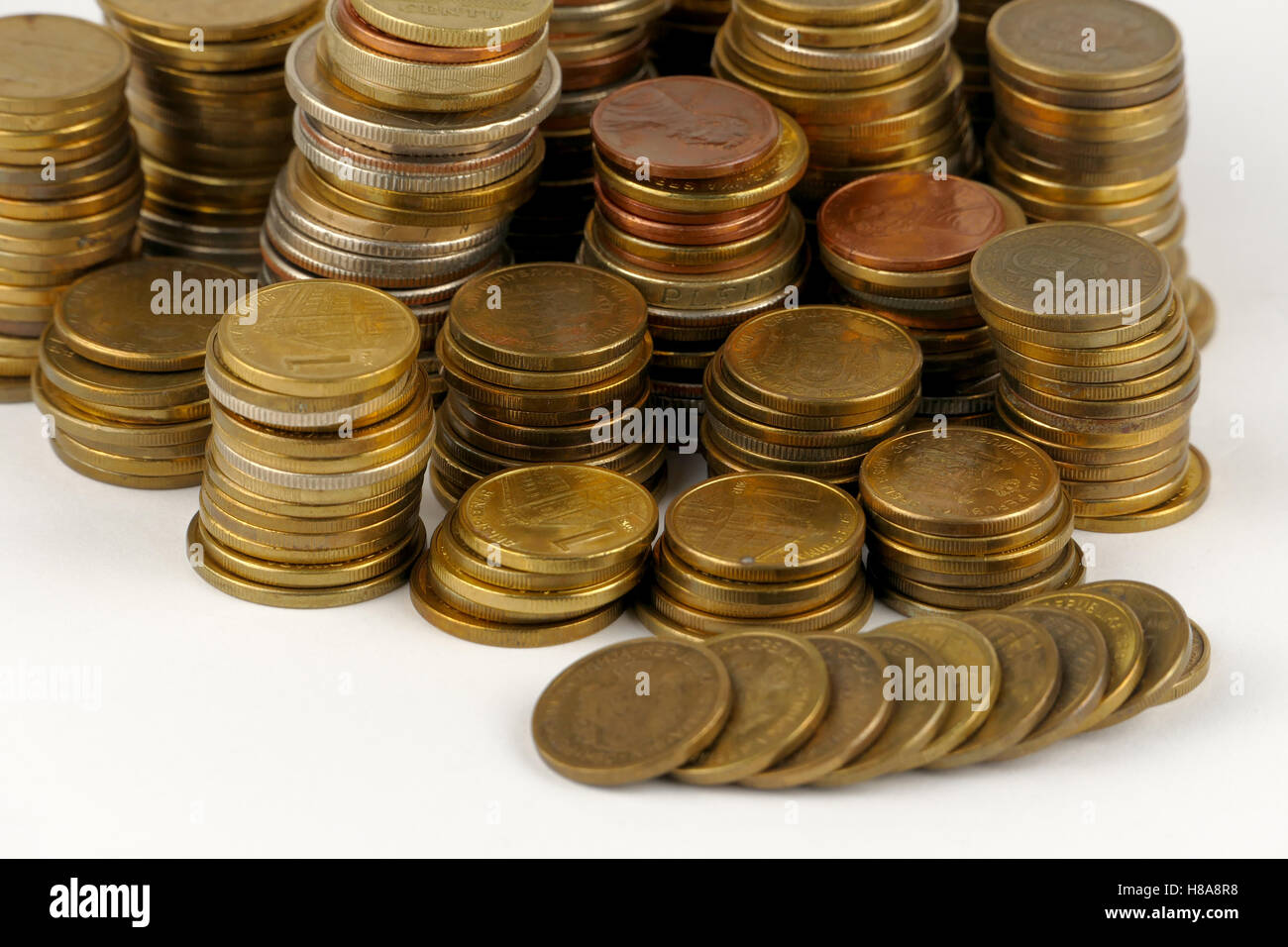 Pile of coins isolated on white background Stock Photo - Alamy
