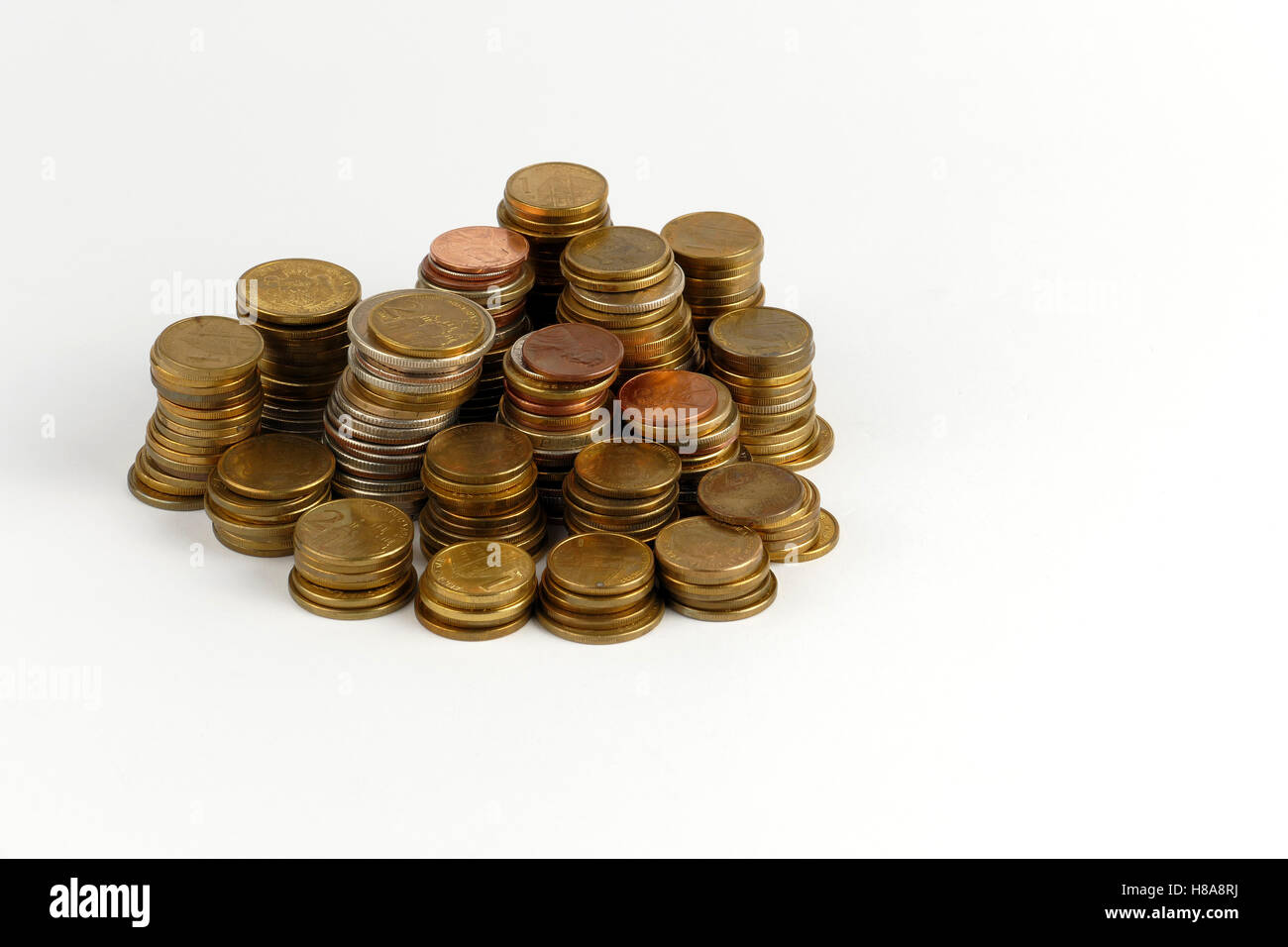 Pile of coins isolated on white background Stock Photo - Alamy
