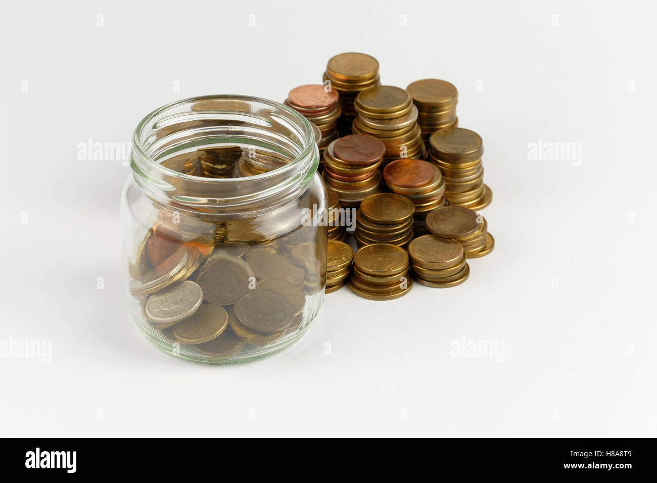 Pile of coins isolated on white background Stock Photo - Alamy