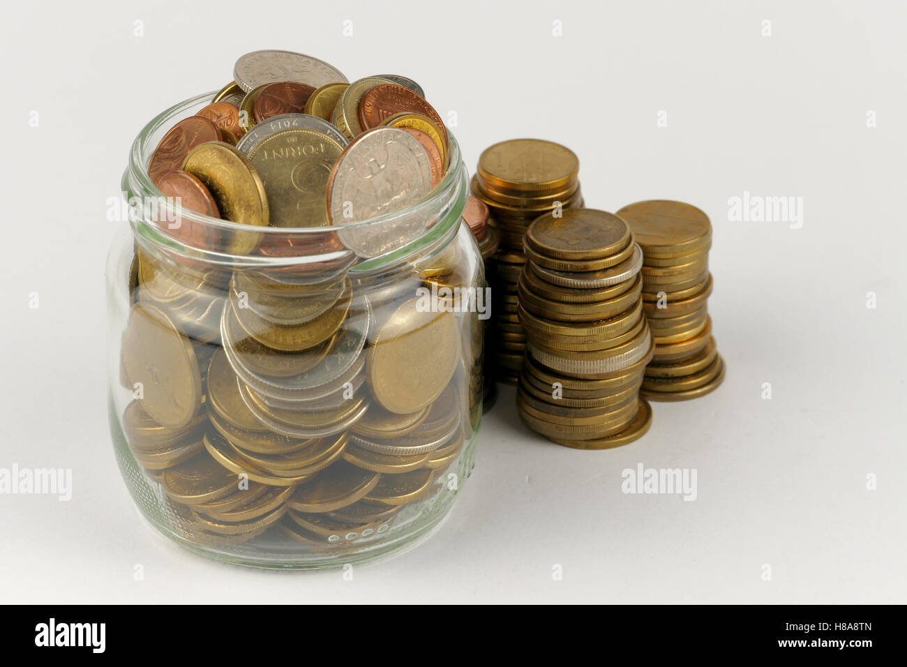 Pile of coins isolated on white background Stock Photo - Alamy