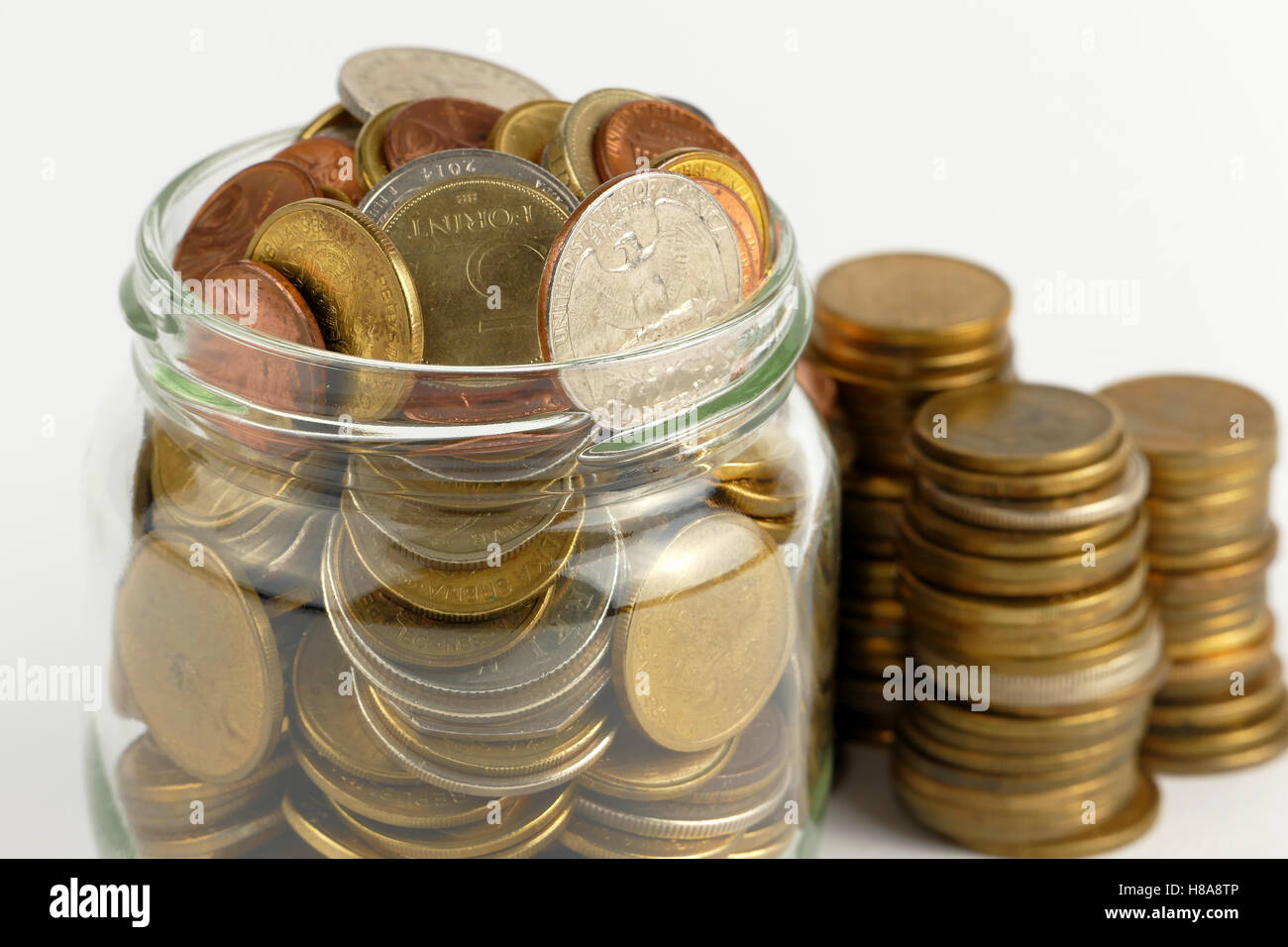 Pile of coins isolated on white background Stock Photo - Alamy