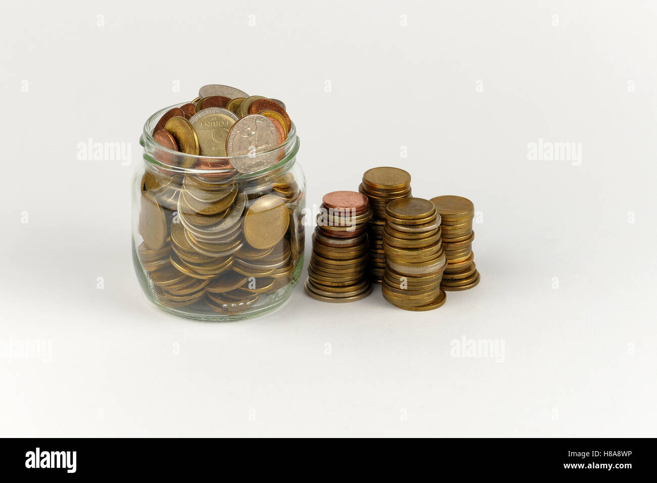Pile of coins isolated on white background Stock Photo - Alamy
