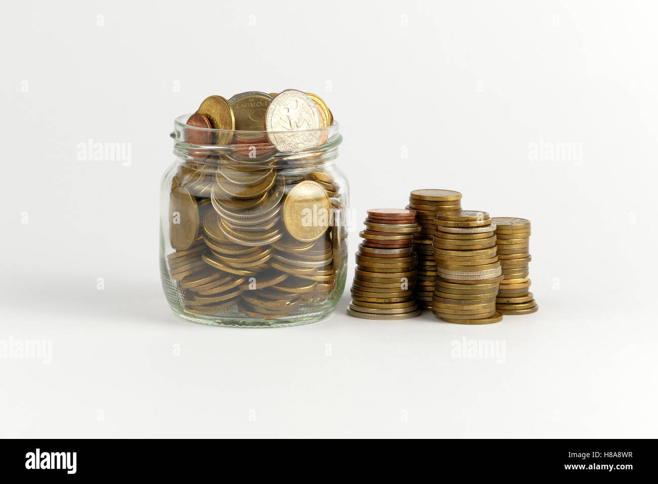 Pile of coins isolated on white background Stock Photo - Alamy