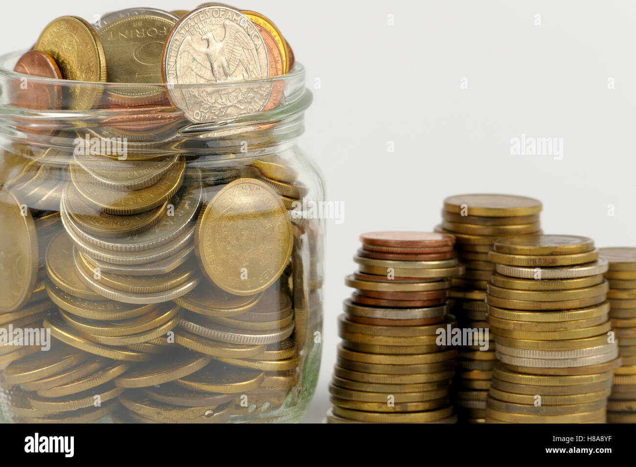 Pile of coins isolated on white background Stock Photo - Alamy