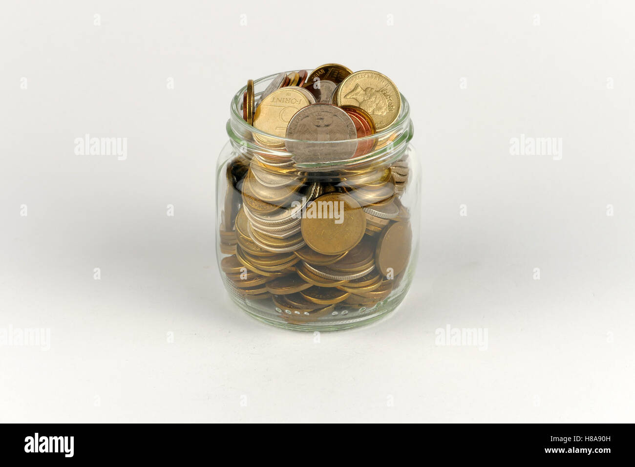 Pile of coins isolated on white background Stock Photo - Alamy
