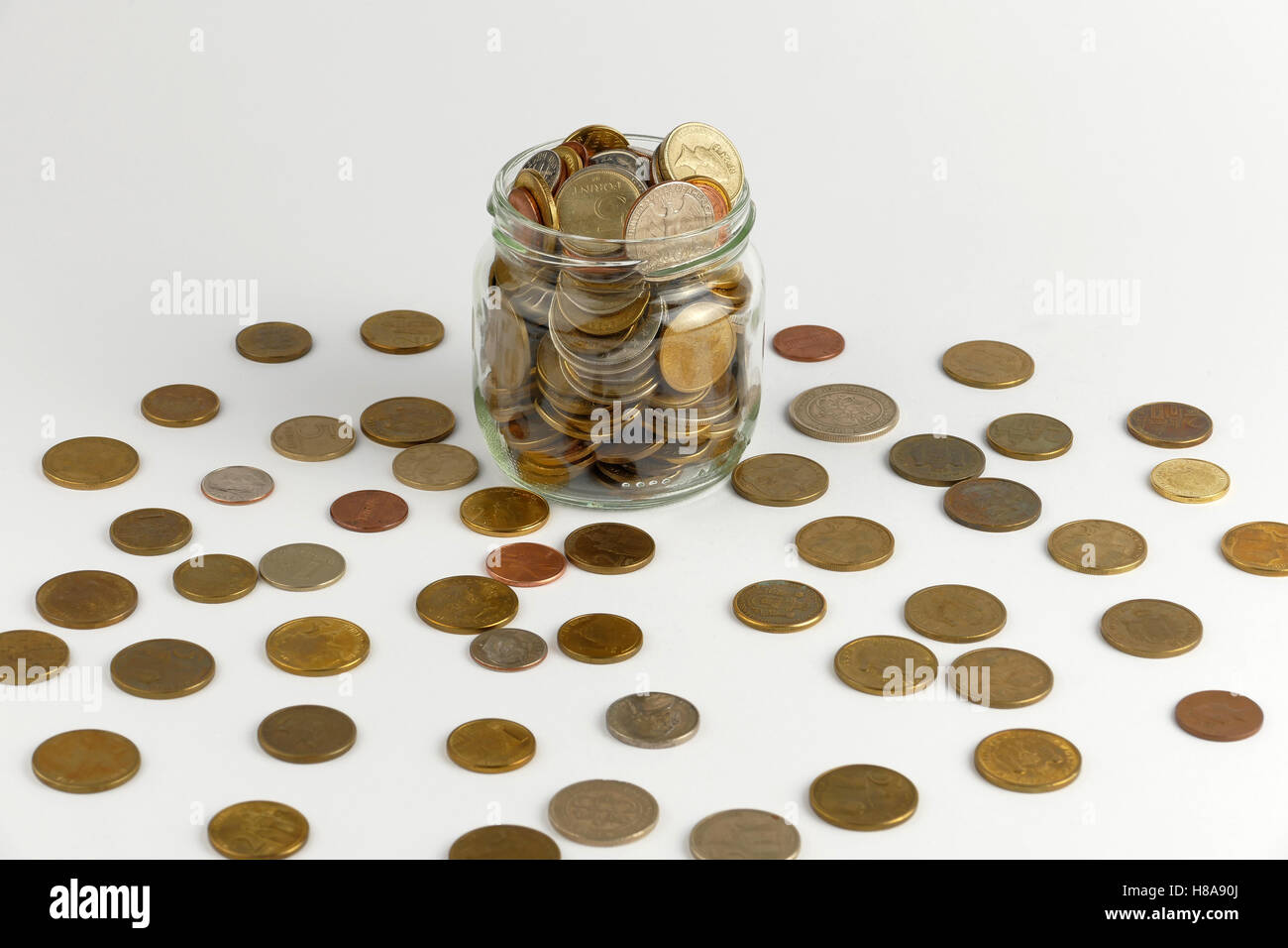 Pile of coins isolated on white background Stock Photo - Alamy