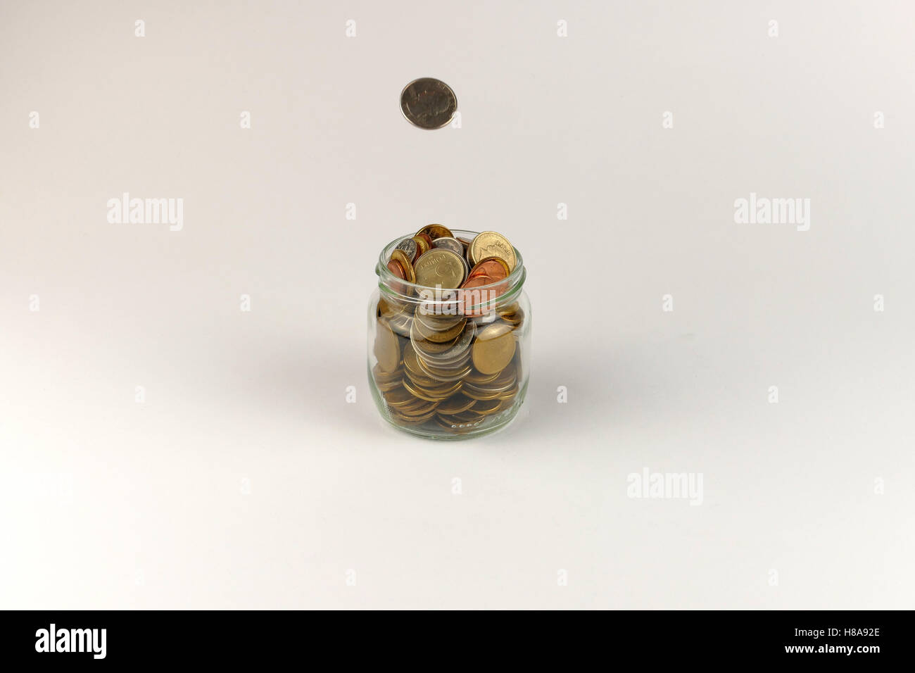 Pile of coins isolated on white background Stock Photo - Alamy