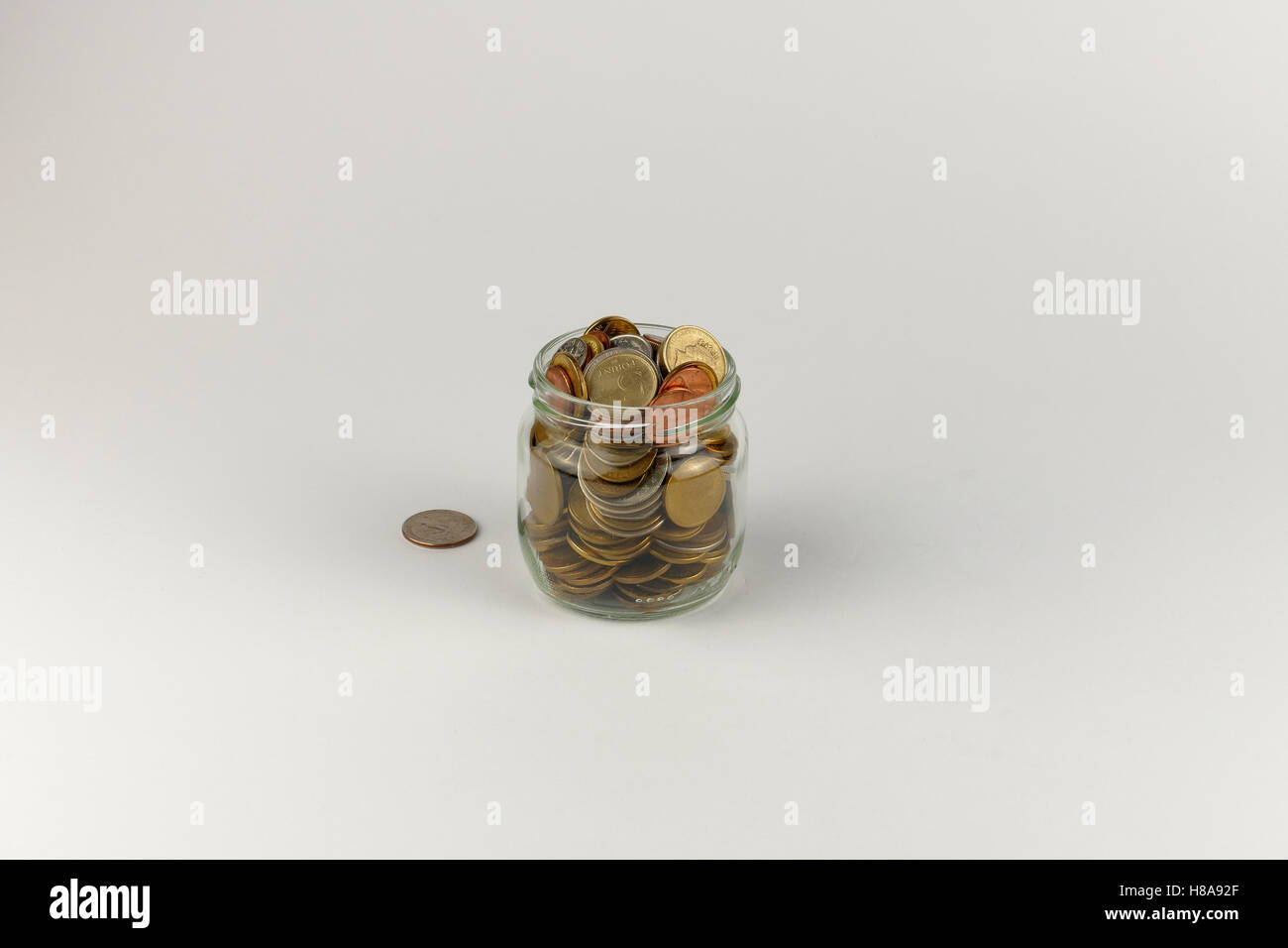 Pile of coins isolated on white background Stock Photo - Alamy