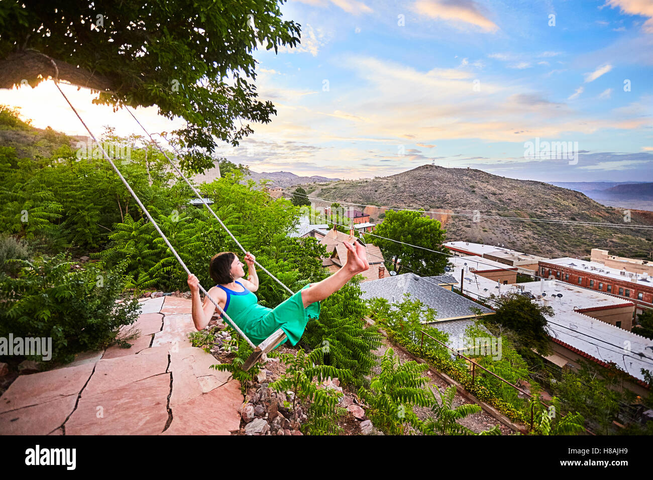Rear woman on swing hi-res stock photography and images - Alamy
