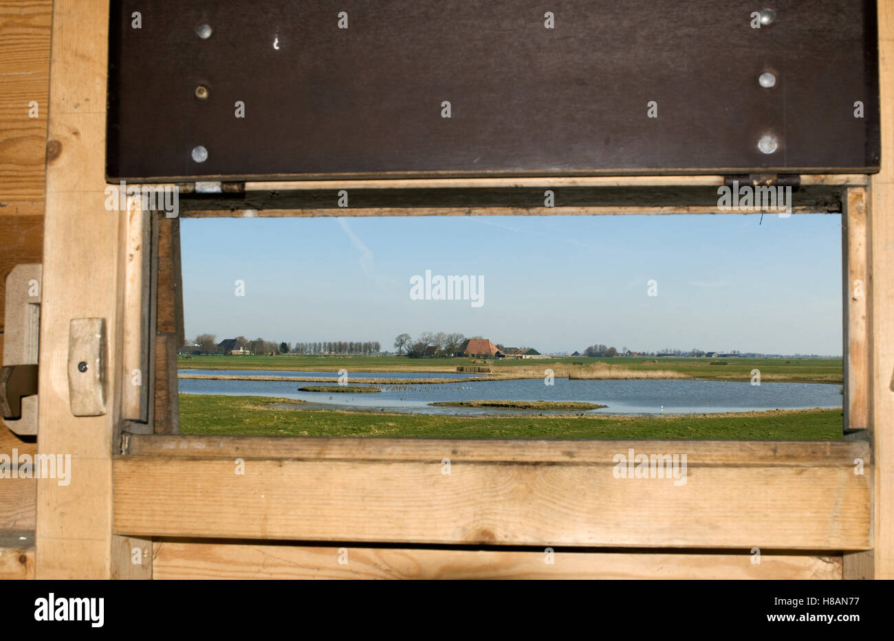 Landscape seen from inside birdwatching hut, Friesland, Netherlands