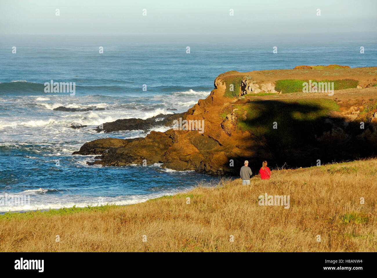 People hiking on the bluffs near Pudding Creek in Fort Bragg, Mendocino County, California Stock Photo