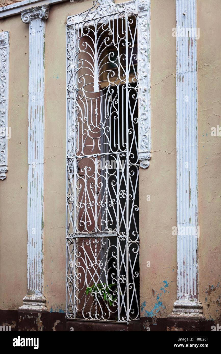 door with bars in the old building Stock Photo