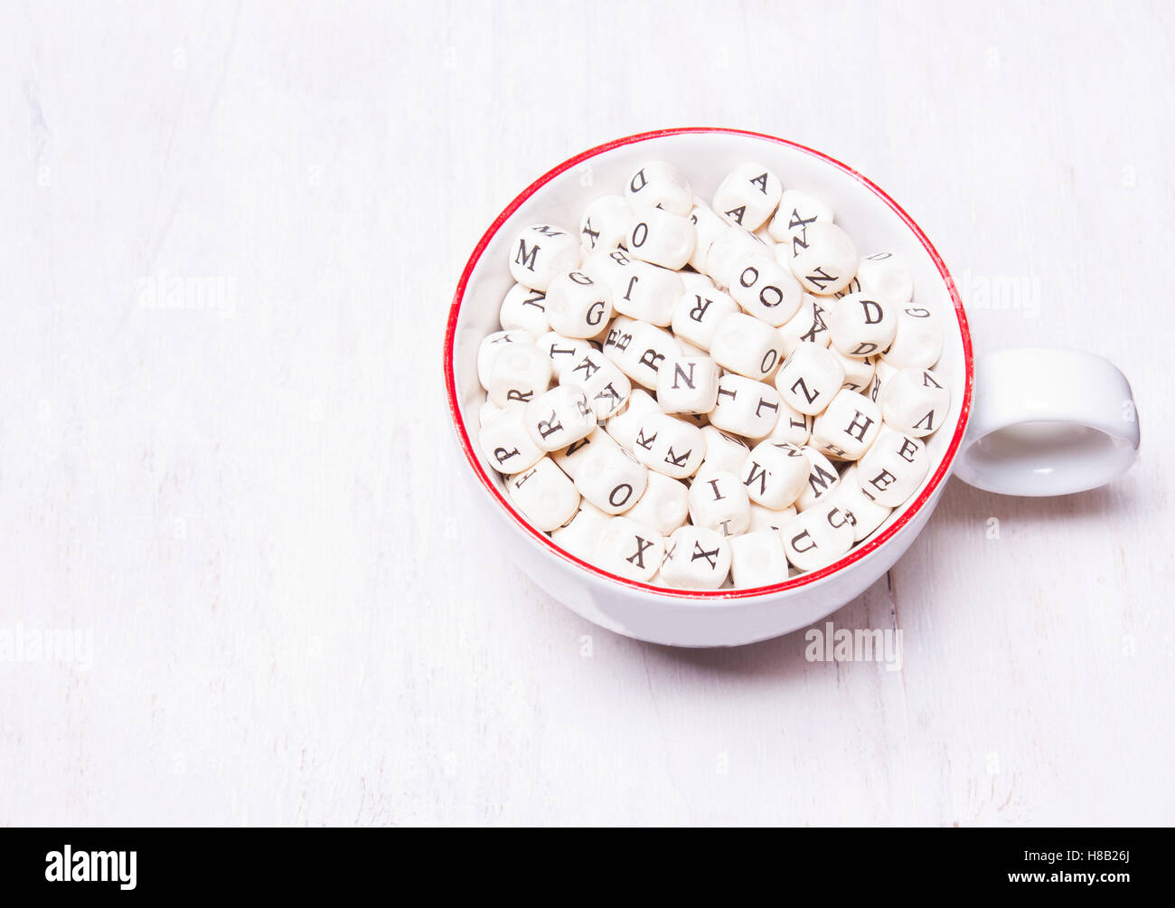 The letters in the cup. Knowledge concept. View from above. Stock Photo