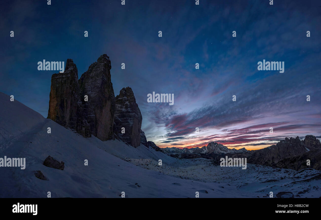 Night landscape with silhouette of Tre Cime mountain, Dolomites Italy Stock Photo