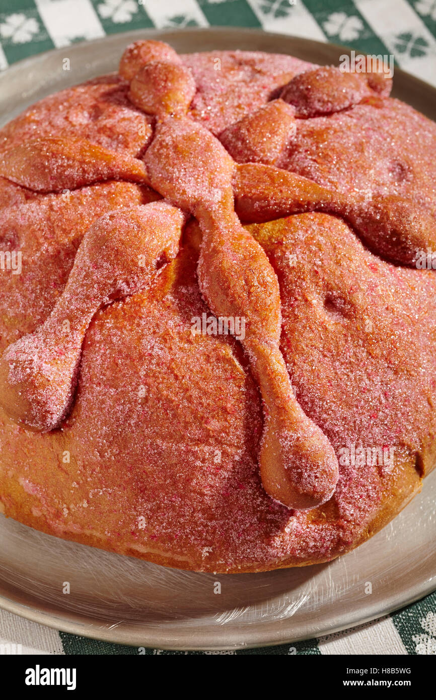 loaf of Mexican red sweet bread with bone decorations for The Day of the Dead Stock Photo