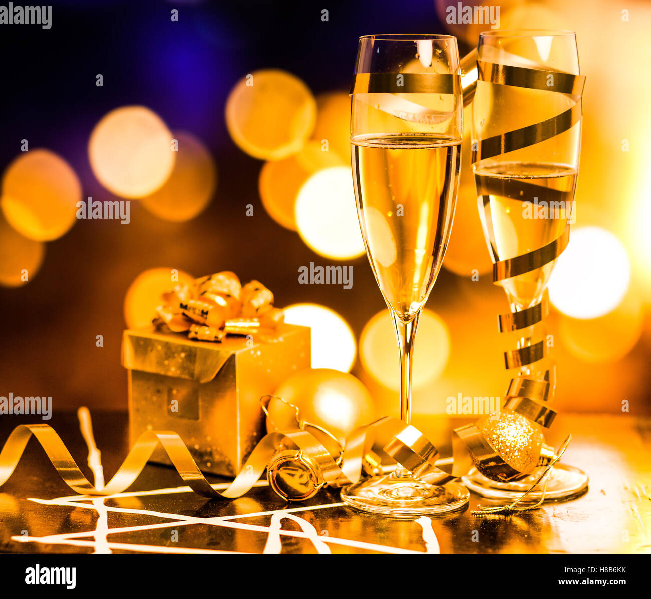 Champagne glasses on sparkling holiday background Stock Photo - Alamy