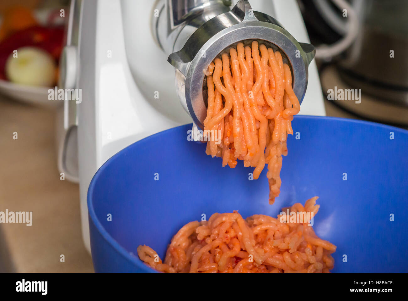 grinder grind meat for stuffing Stock Photo Alamy