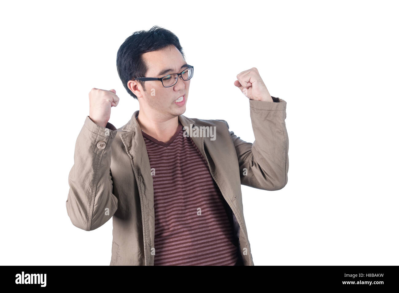 Successful happy and attractive businessman rejoicing raising his face