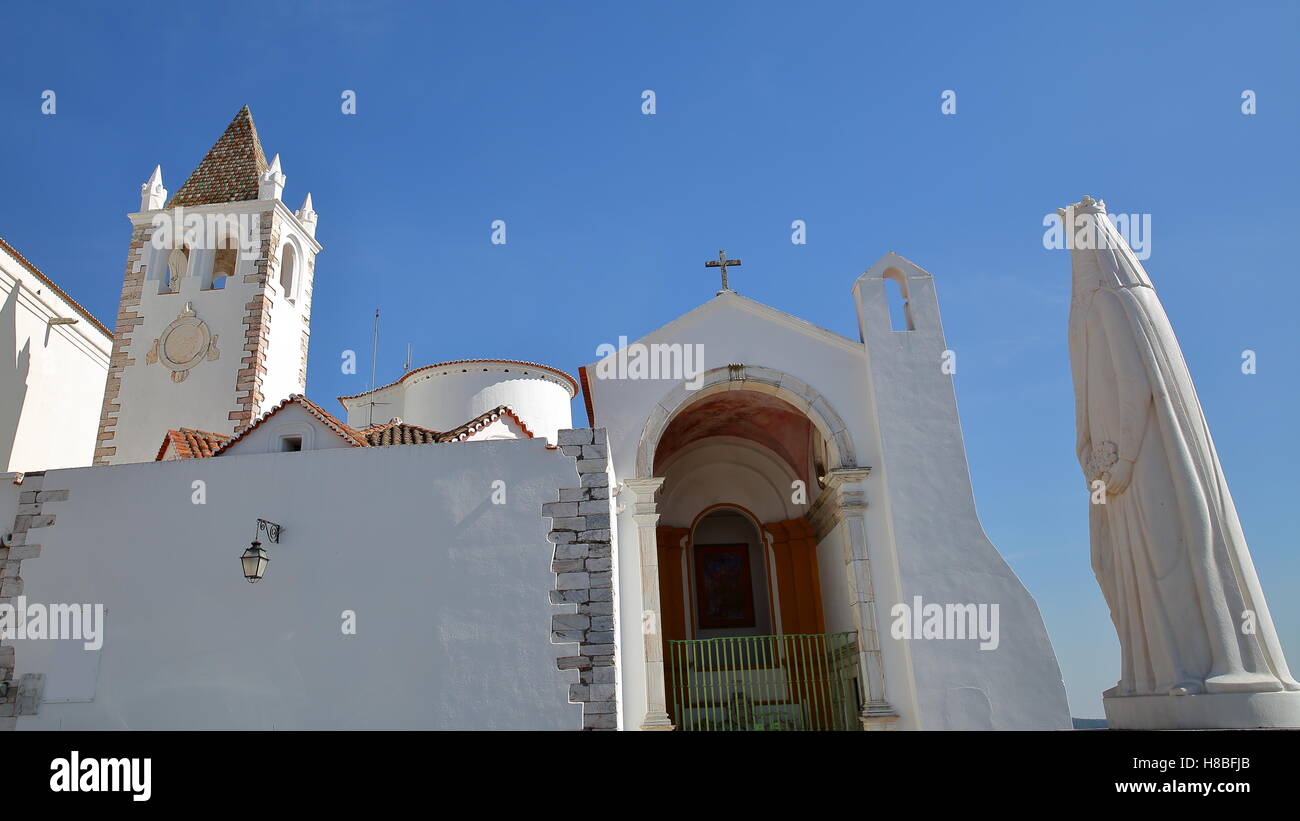 ESTREMOZ, PORTUGAL: The Santa Maria Church and the statue of Queen Santa Isabel of Portugal Stock Photo