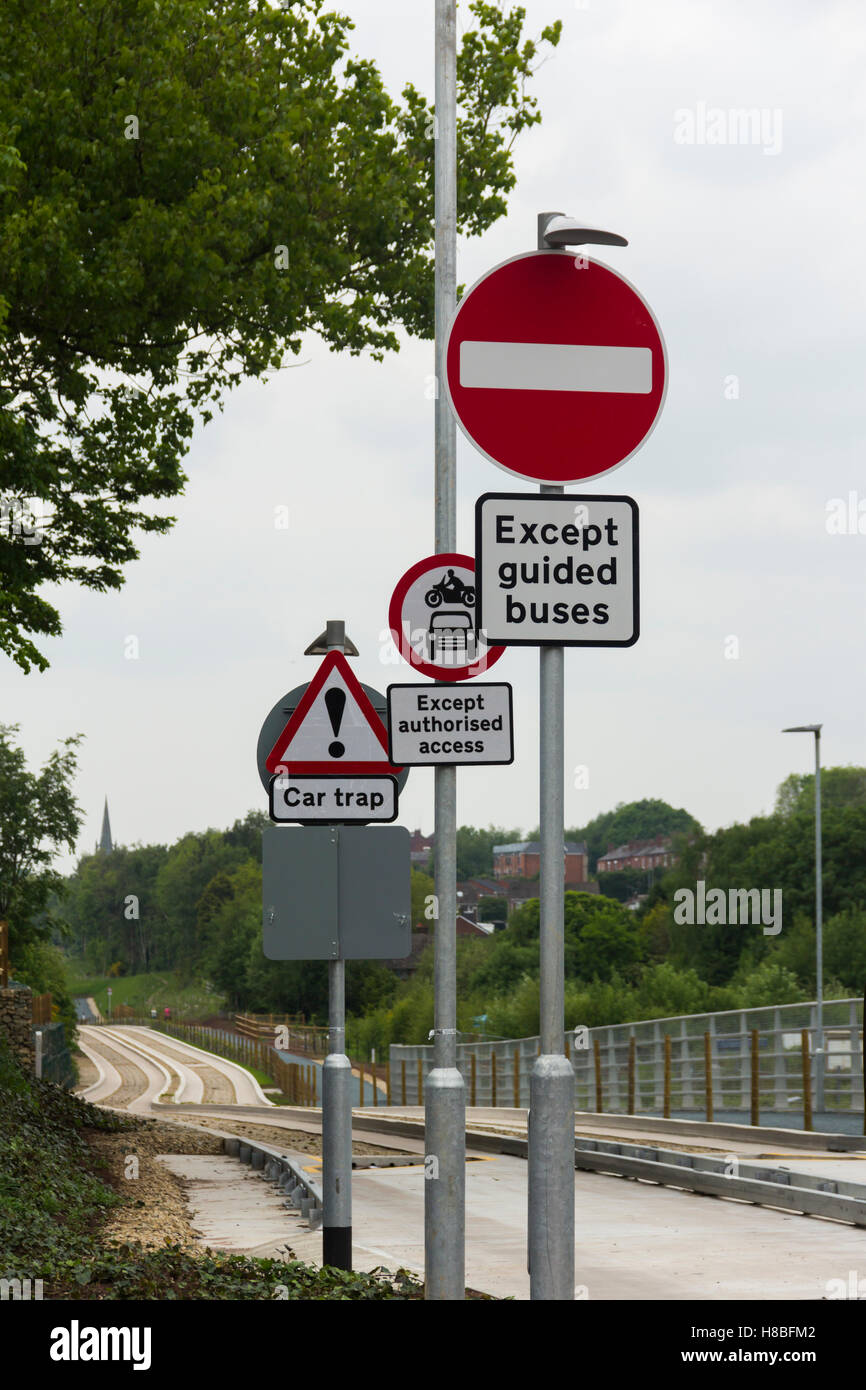 Warning signs barring unauthorised road vehicles from joining the Manchester to Leigh guided busway at Hough Lane, Tyldsley Stock Photo