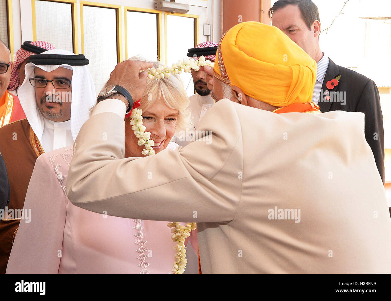 Duchess of Cornwall receives a garland of flowers on arrival at the Krishna Temple, in Manama