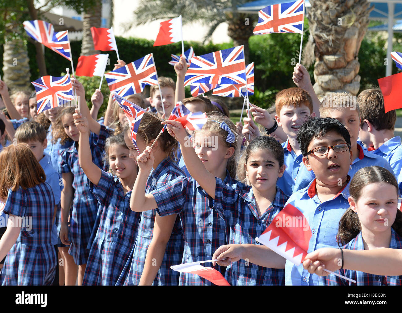 The Duchess of Cornwall is greeted by flag waving pupils at the St Christopher School in Manama, the capital city of Bahrain, during a visit to the country by the royal couple as part of their tour of the Middle East. PRESS ASSOCIATION Photo, Picture date: Thursday November 10, 2016. See PA story ROYAL Tour. Photo credit should read: John Stillwell/PA Wire Stock Photo