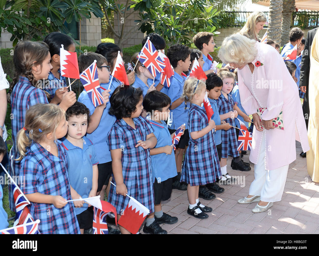 The Duchess of Cornwall is greeted by flag waving pupils at the St Christopher School in Manama, the capital city of Bahrain, during a visit to the country by the royal couple as part of their tour of the Middle East. PRESS ASSOCIATION Photo, Picture date: Thursday November 10, 2016. See PA story ROYAL Tour. Photo credit should read: John Stillwell/PA Wire Stock Photo