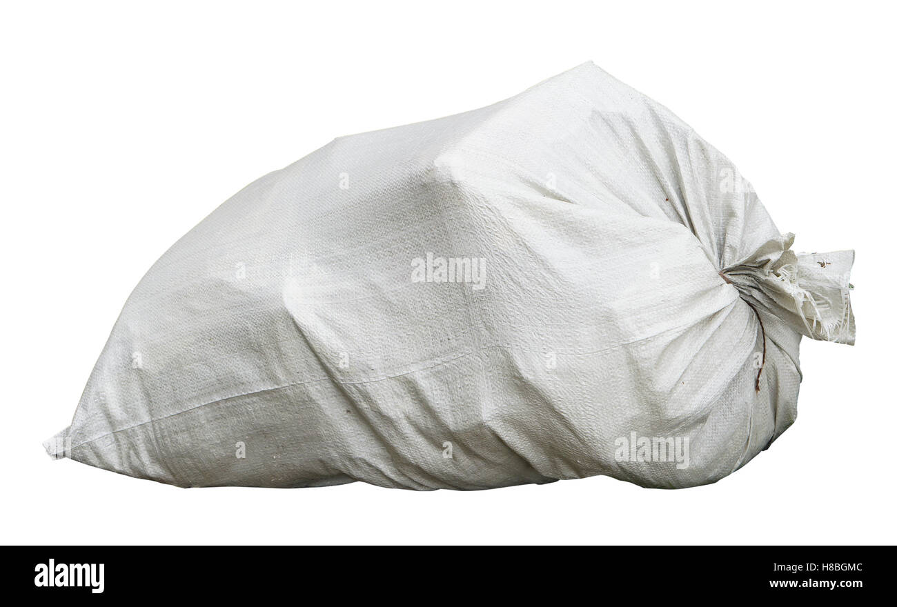 The  bag with construction debris is made of a white synthetic sacking. Isolated on white Stock Photo