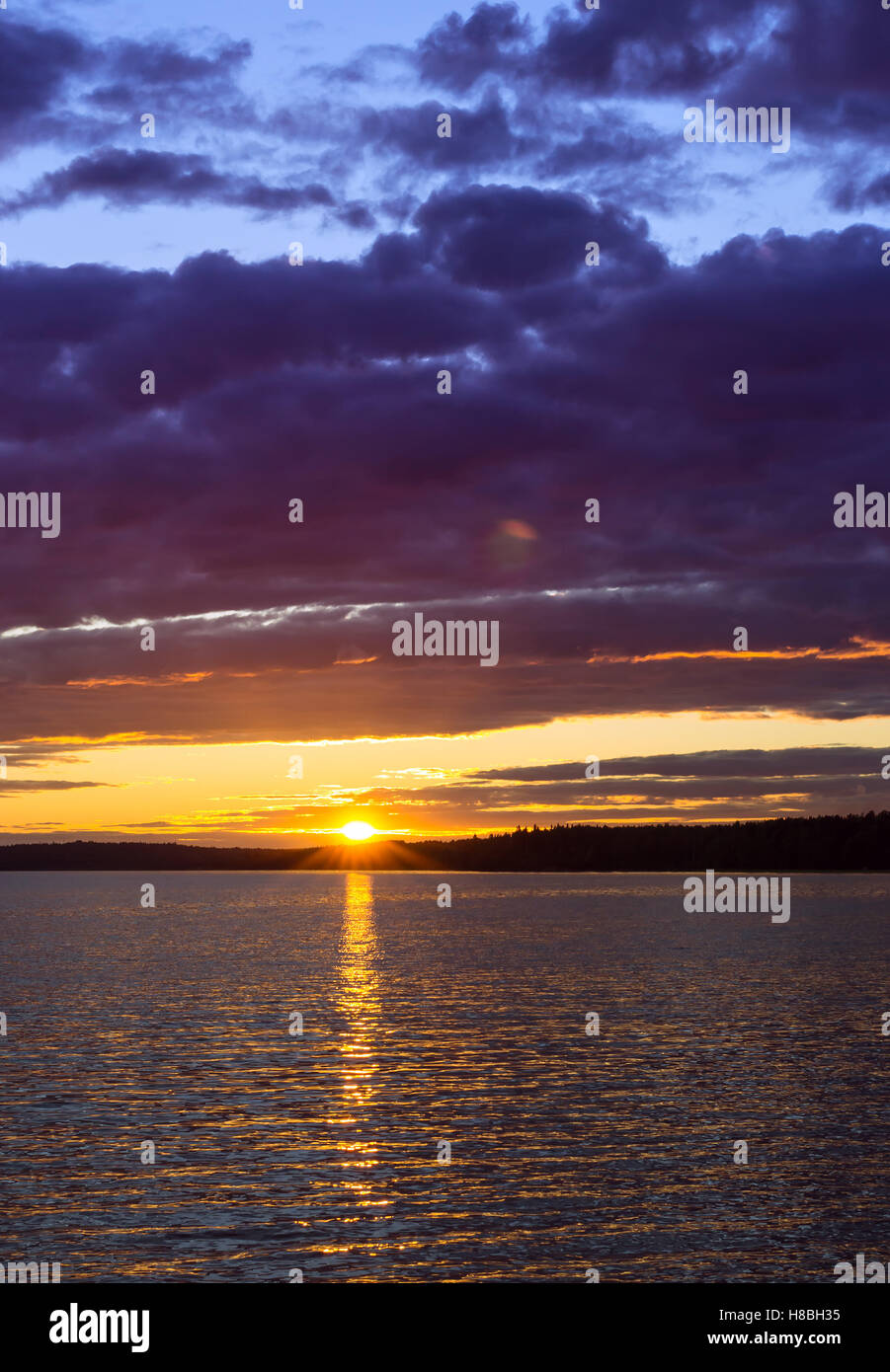 Vyborg. Bright summer sunset over Gulf of Vyborg. Evening calm in sea Bay, Leningrad region, Saint-Petersburg, Russia Stock Photo