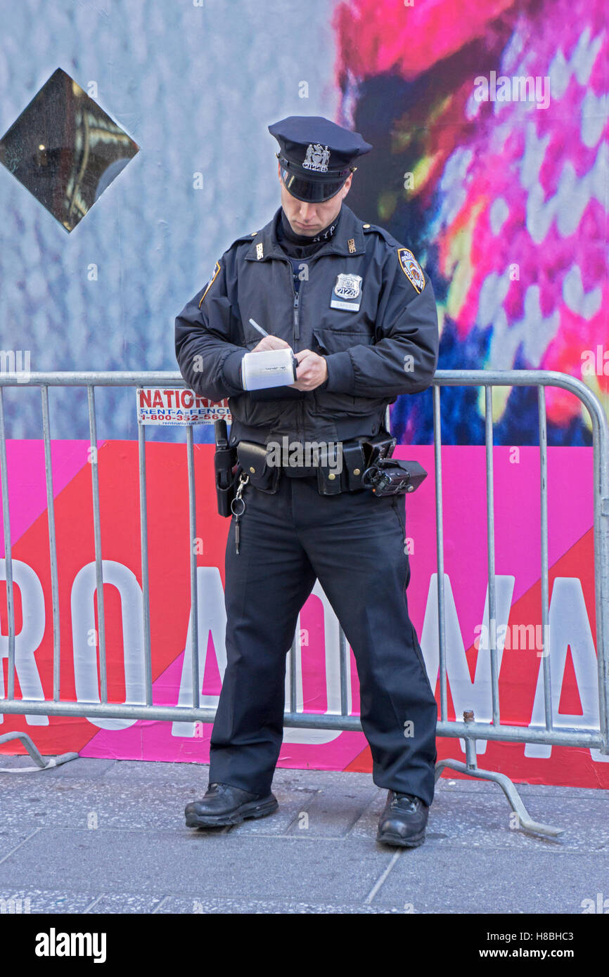 stock photo police officer writing ticker