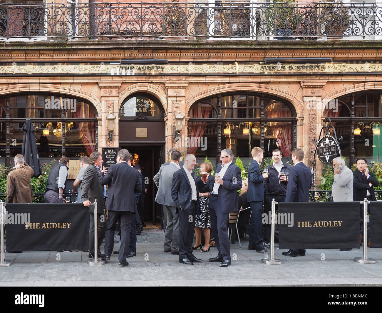 Happy crowd outside a London pub Stock Photo