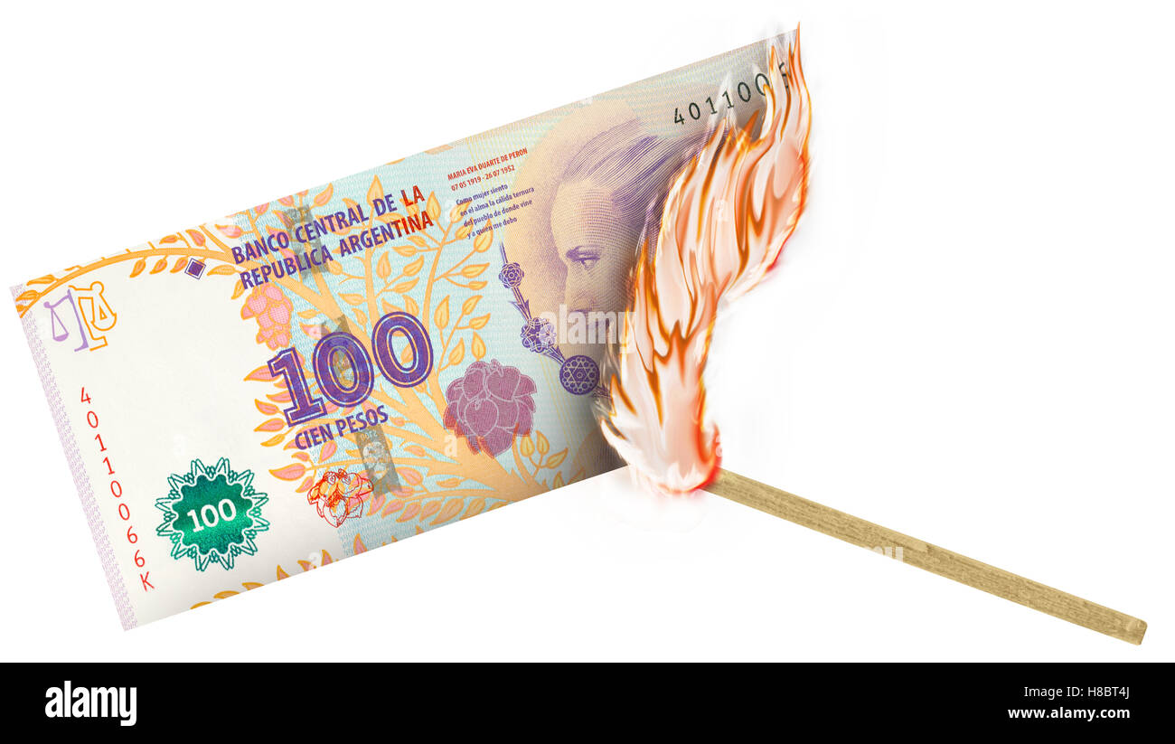 A banknote being burned by a match with burning in a big flame Stock