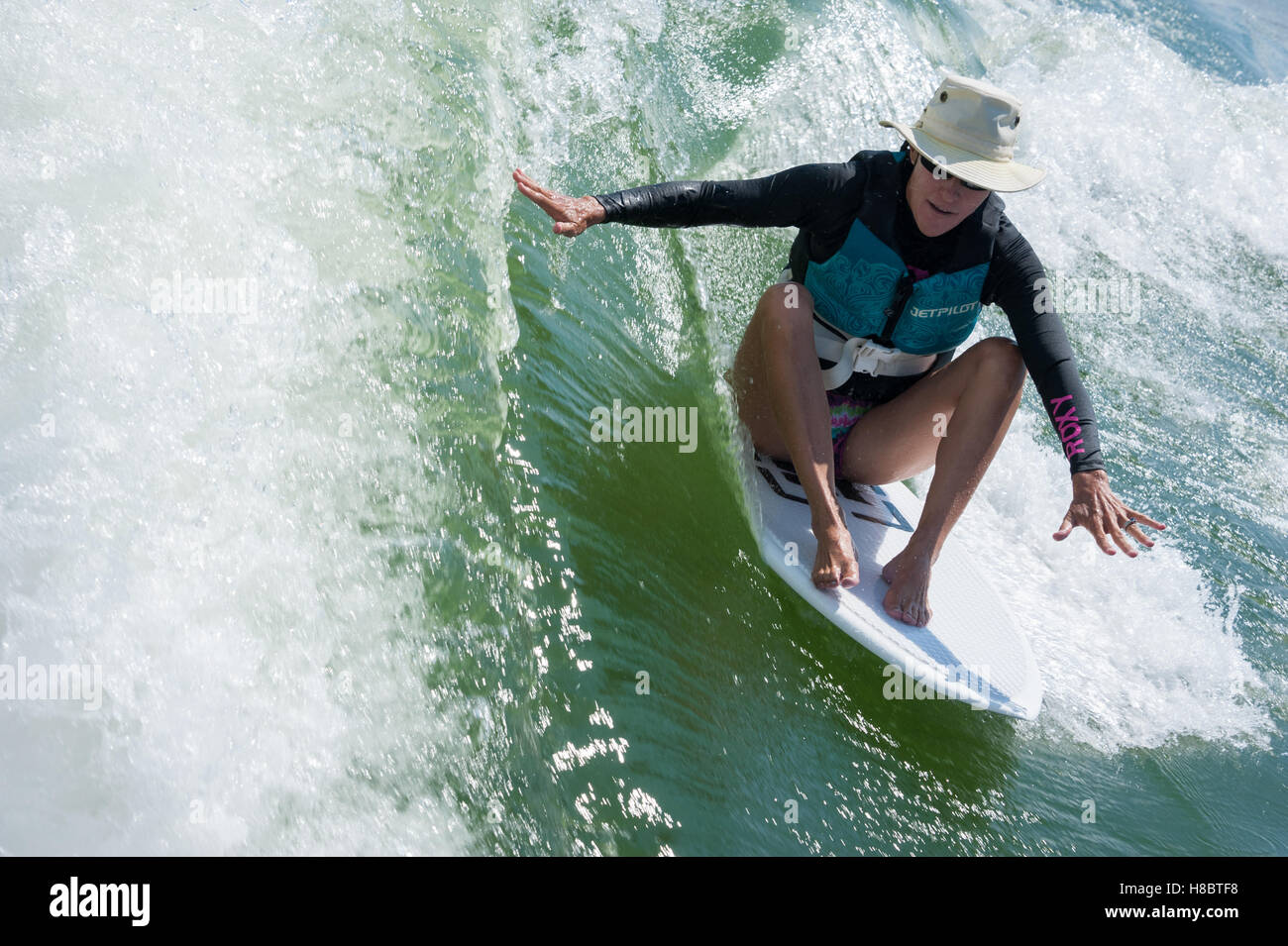 Female surfer wetsuit hi-res stock photography and images - Alamy
