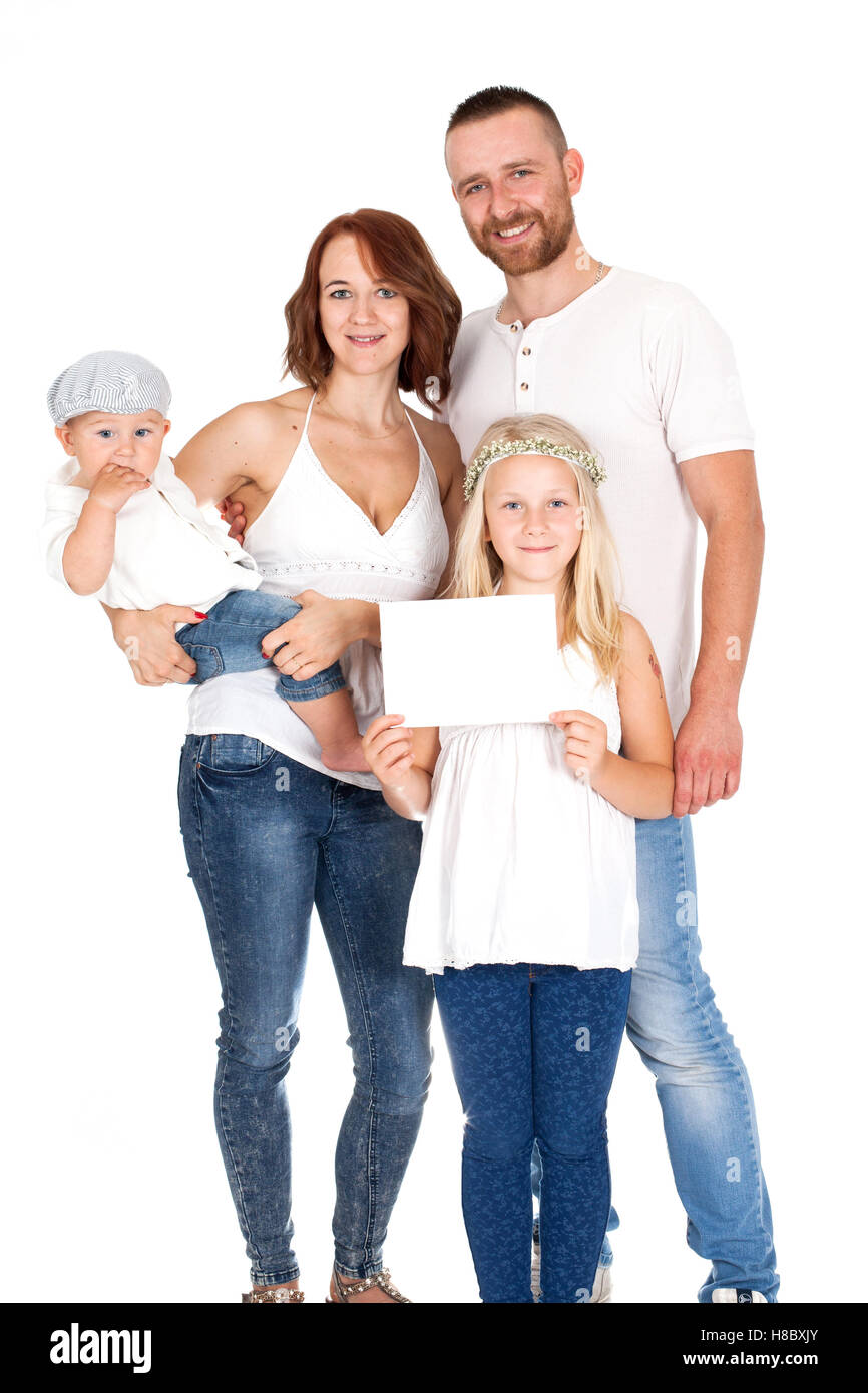 family, a group of people in white shirts and jeans holding a card Stock Photo