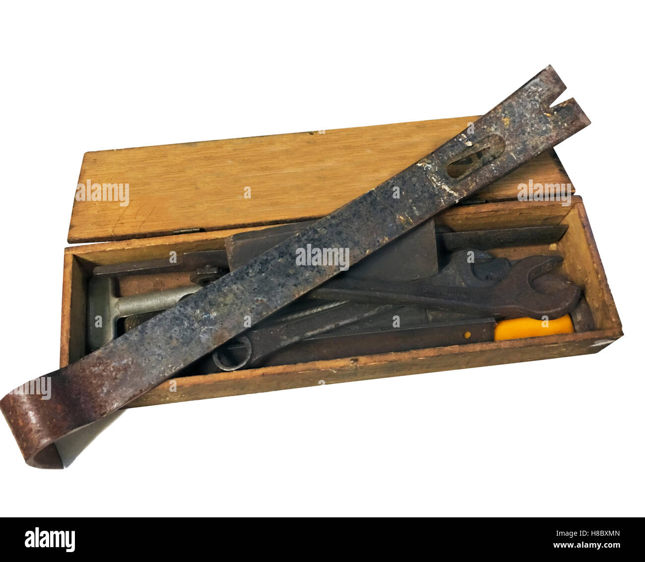 Old metal tools in a wooden box with white background Stock Photo