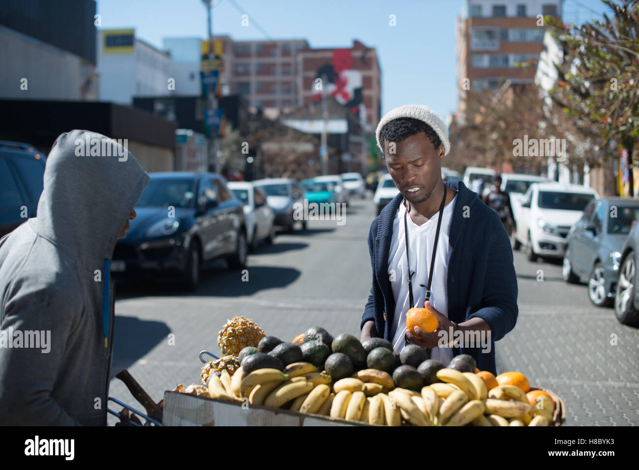 Man buying fruit from a street vendor in Johannesburg Stock Photo Alamy