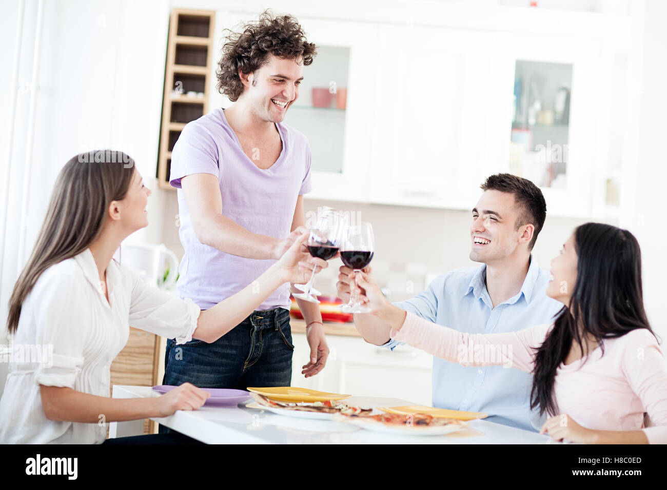 Group of friends drinking red wine. Stock Photo
