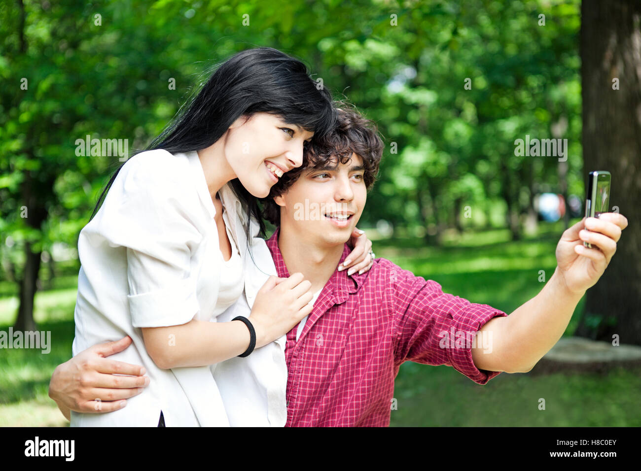 Young Caucasian couple making an outdoor selfie. Stock Photo