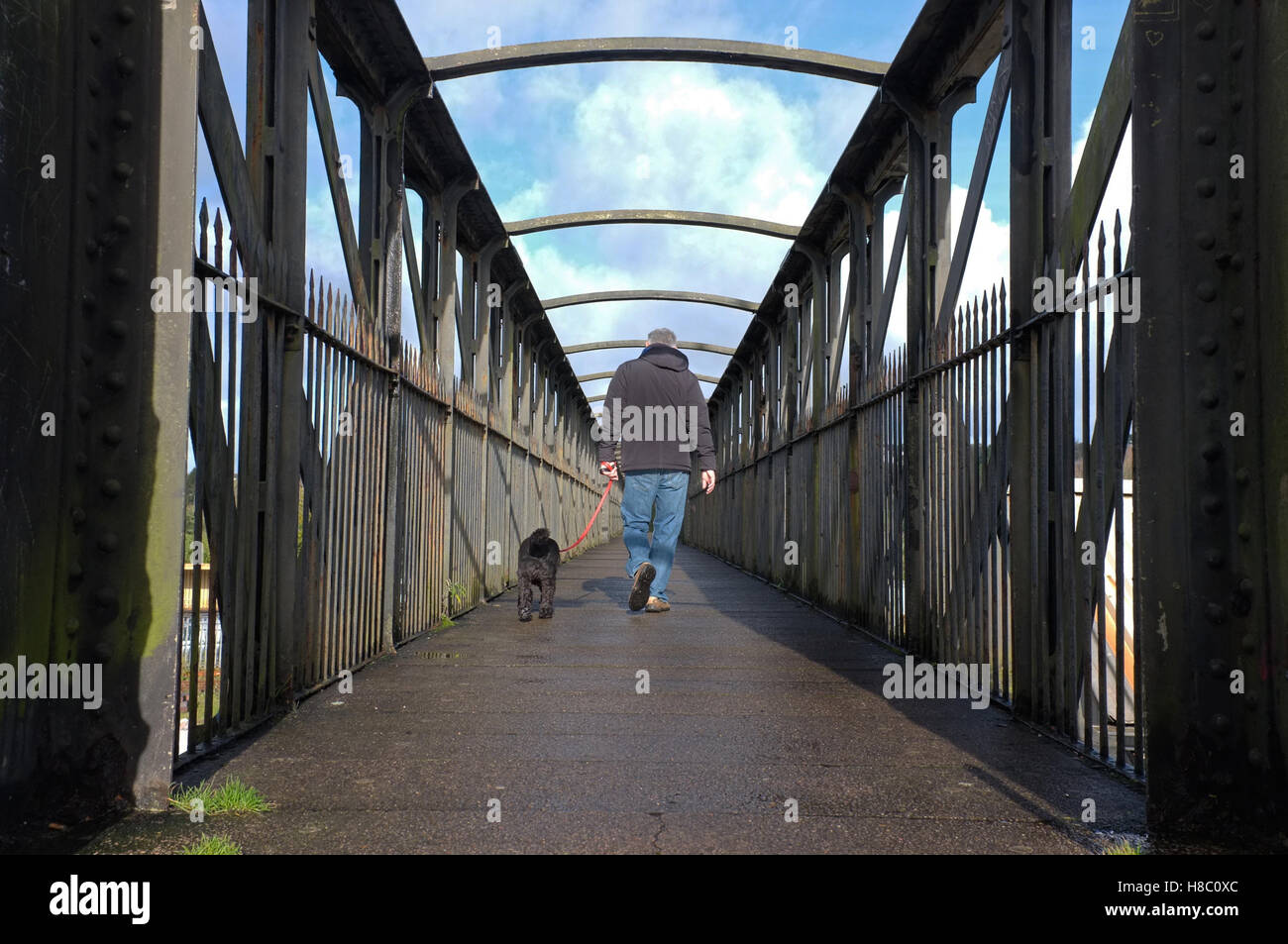 Man walking over a bridge hi-res stock photography and images - Alamy